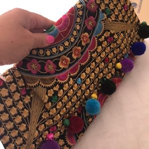 Embroidered Pom Pom flower clutch bag.